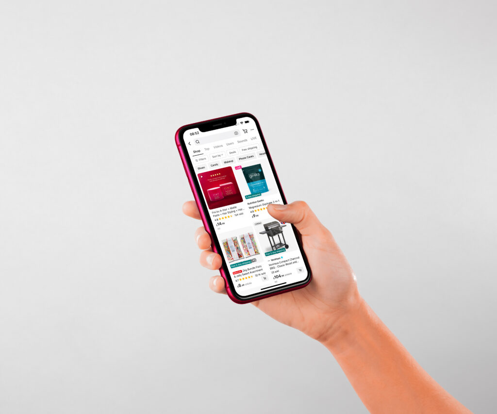 Person Using Their Hand to Browse TikTok Shop on a Mobile Device